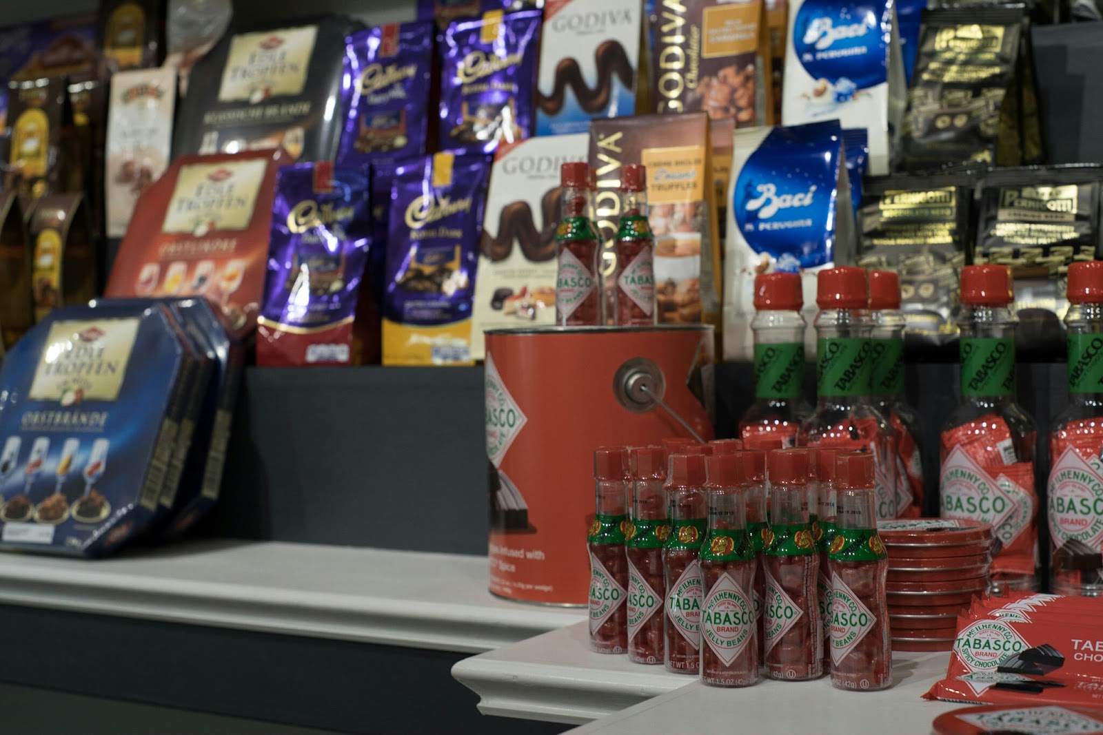 Close display of colorful specialty candy and chocolate products